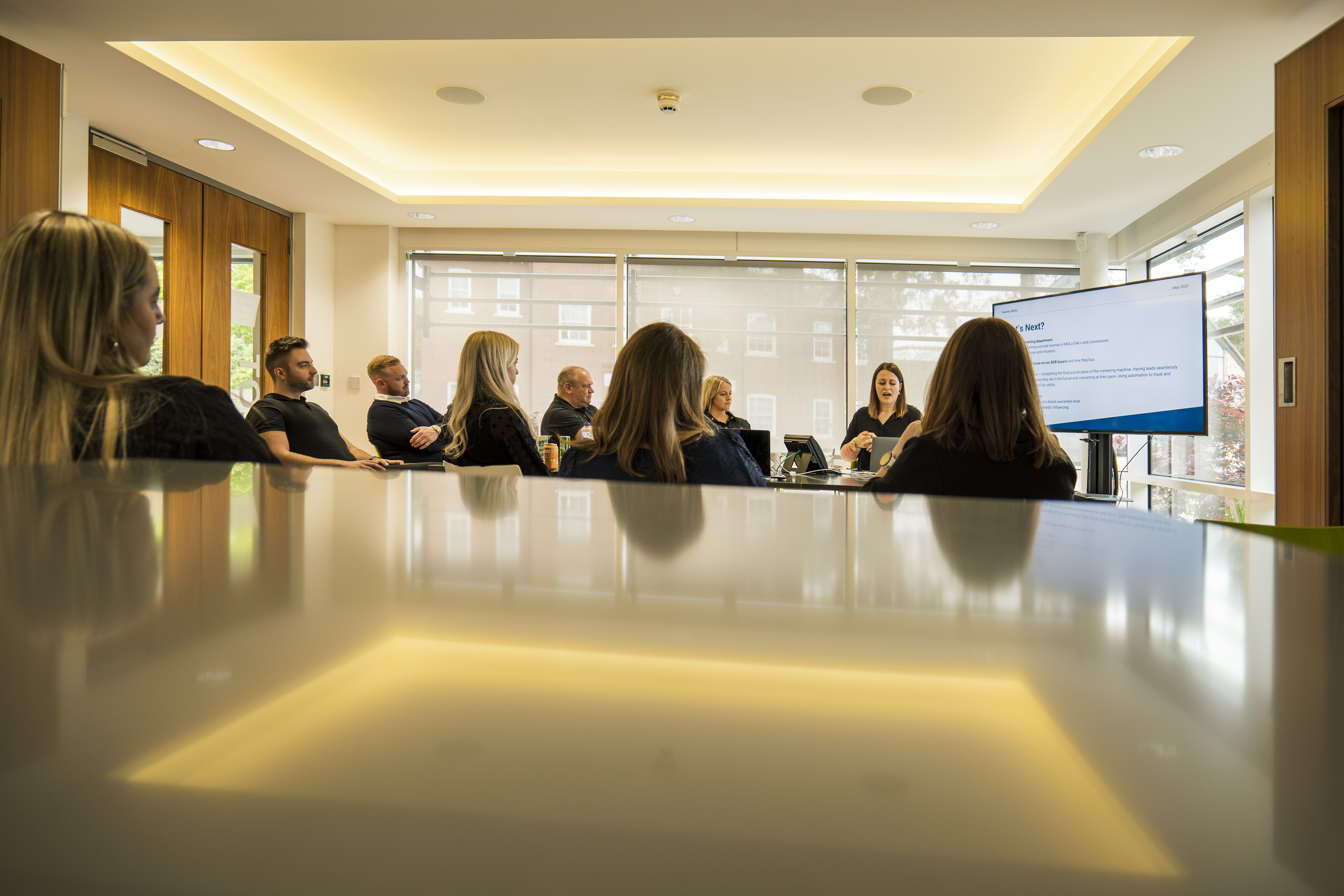 Headley Media colleagues discussing demand generation and lead generation