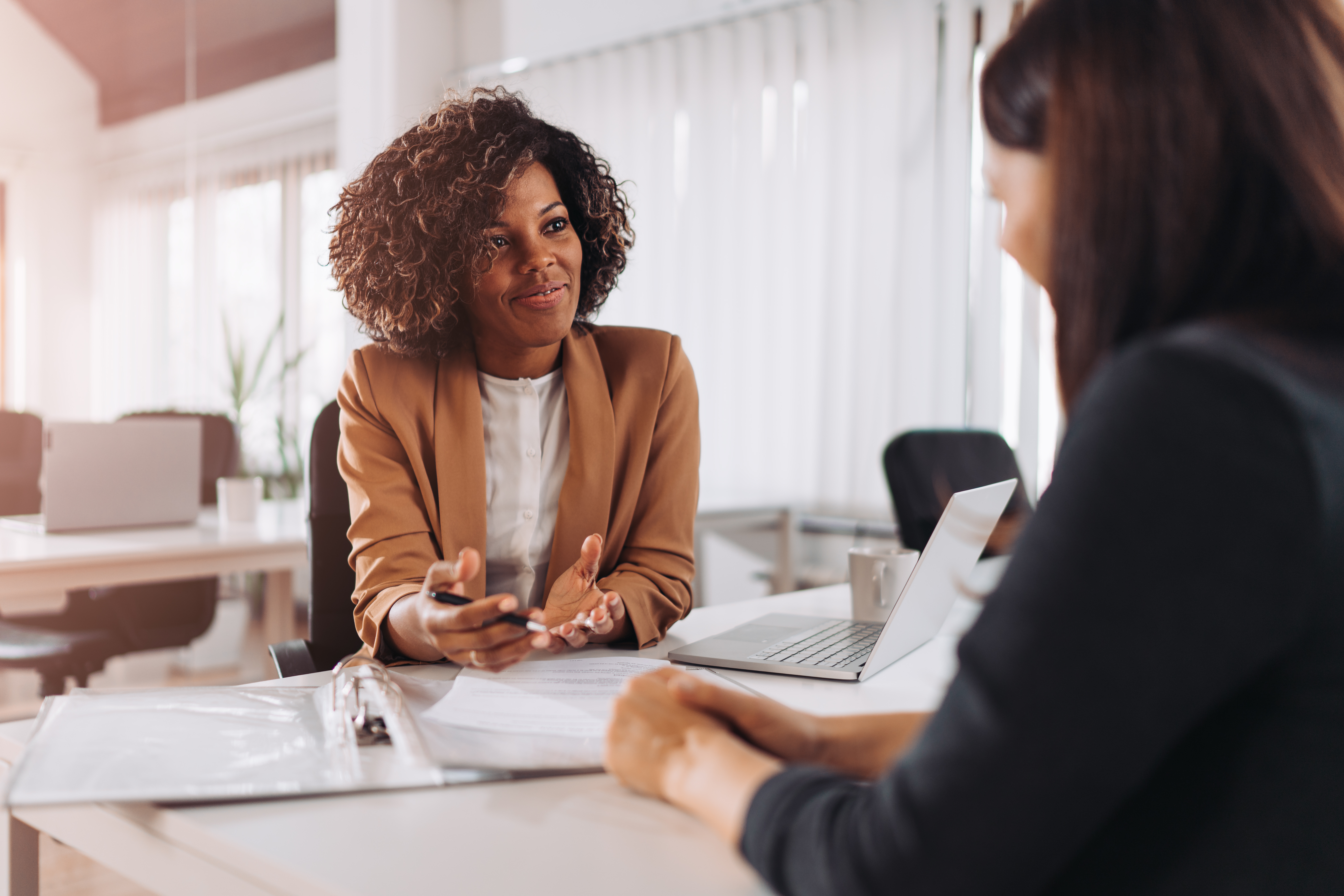 Two women talking in an interview