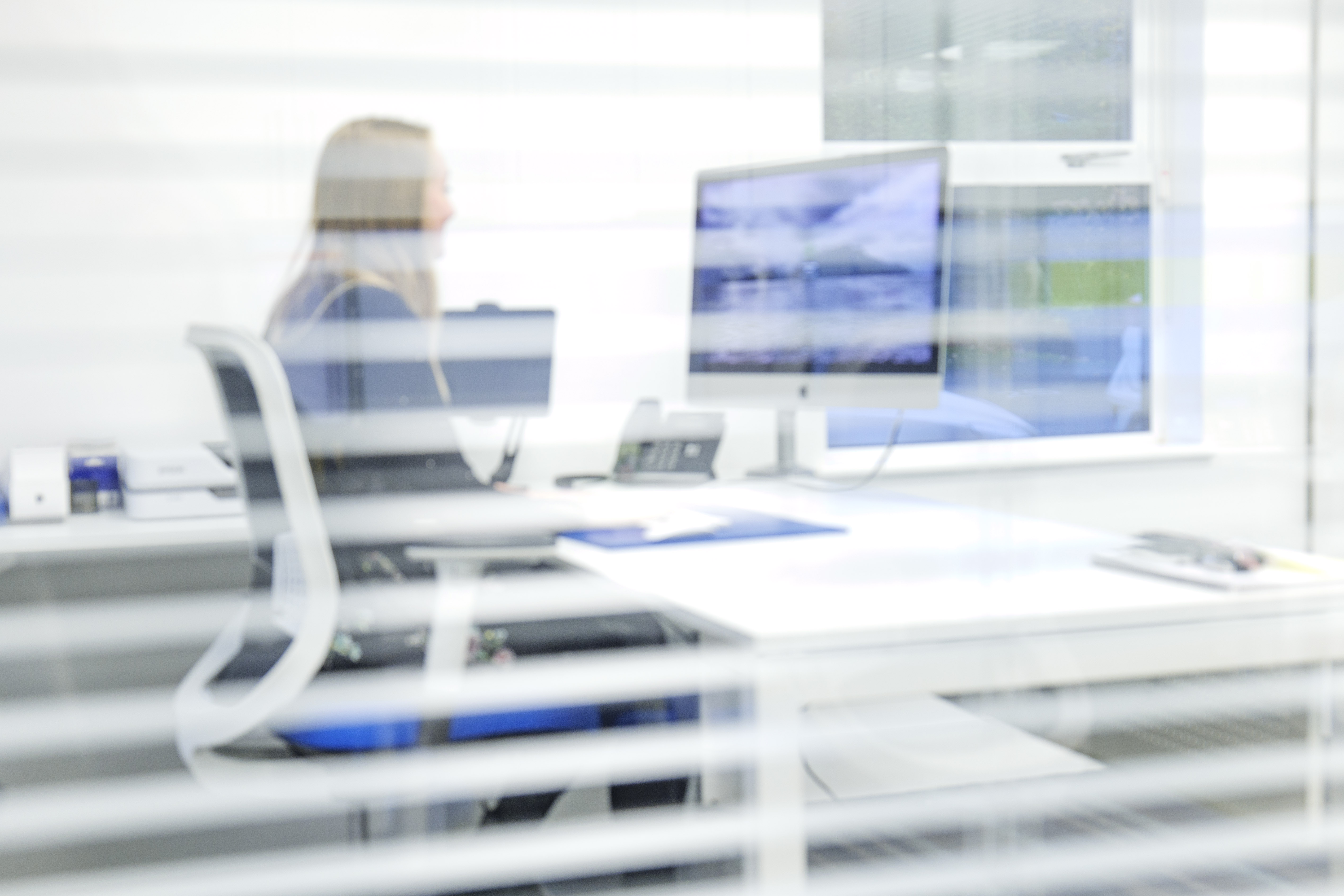 Headley media colleague working at desk in the office